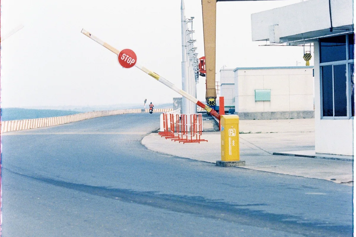 A border checkpoint barrier on a West Africa coach route